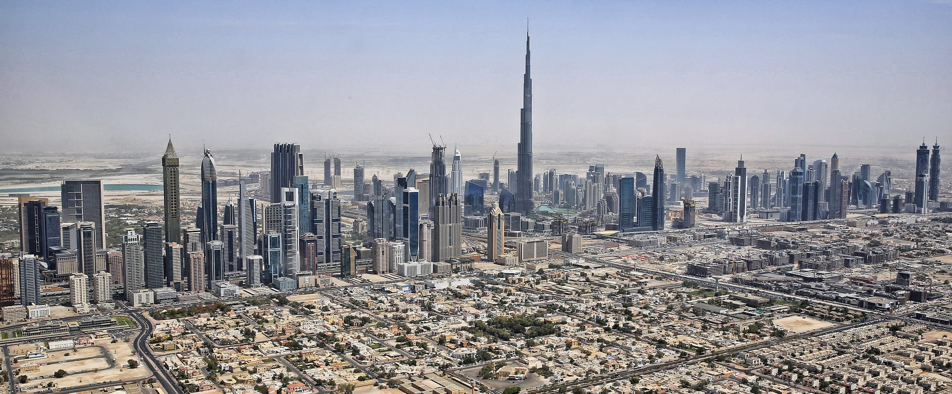 Burj Khalifa, the world's tallest building, illuminated against the Dubai skyline at sunset